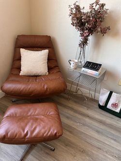 Brown faux leather chair with ottoman