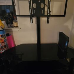 Swivle TV Stand And Glass Table 