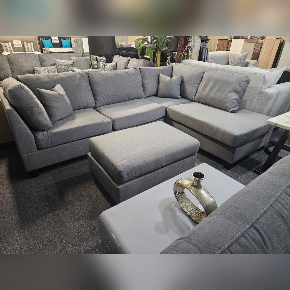 Gray Reversible sectional sofa with ottoman