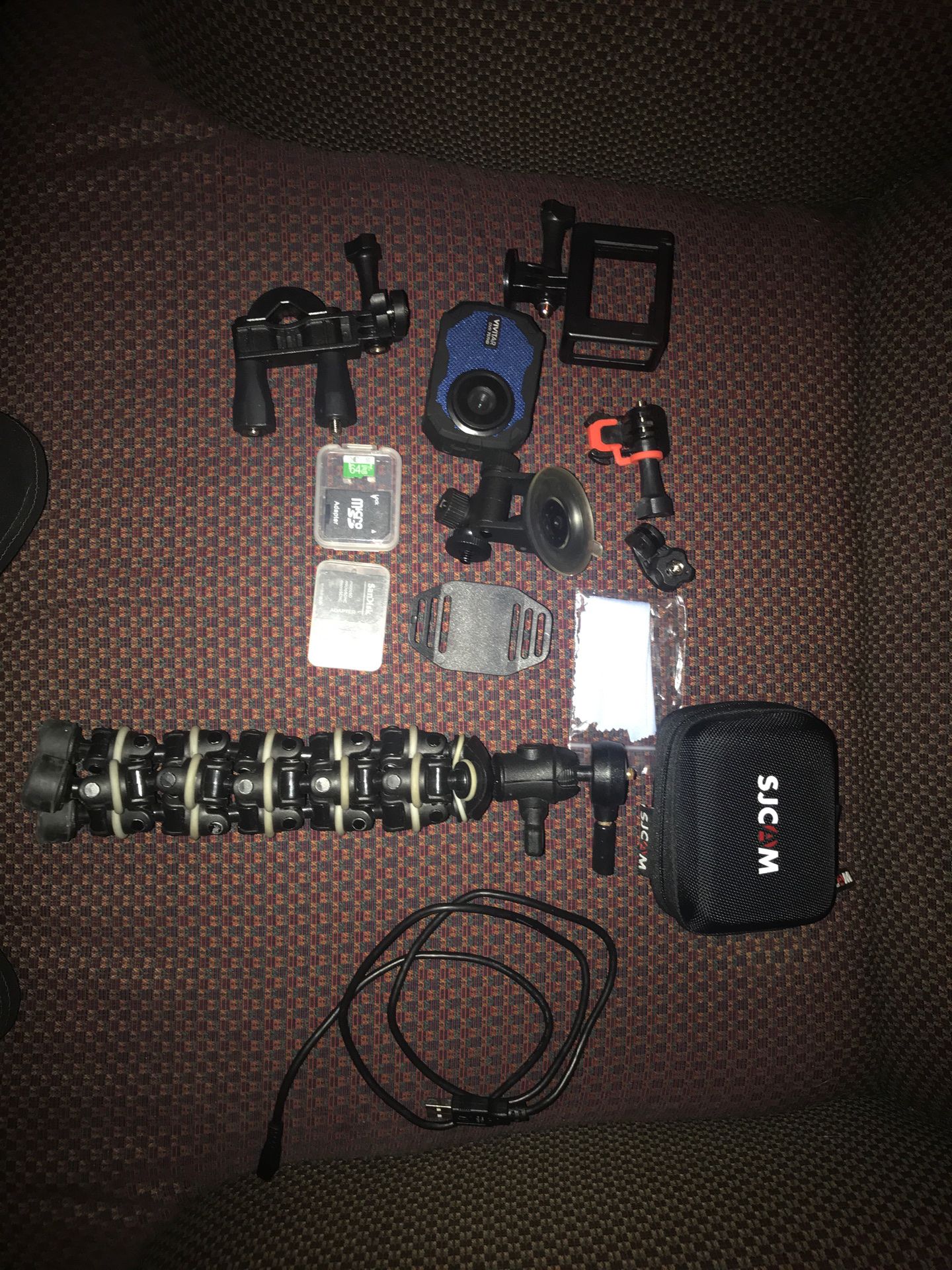 Vivitar DVR 757HD camera with all accessories (including Tripod, 2 Micro SD chips, helmet gear, car gear and one charger).