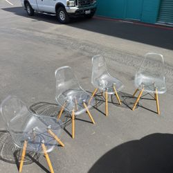 Clear Plastic And Wooden Chairs