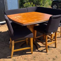 Tall Table With Wrap Around bench And 4 Chairs.  Table Is Solid Wood, Needs To Be Sanded, 36 1/2 Inches Tall Be 46 In Square.  Benches Need To Be Reap