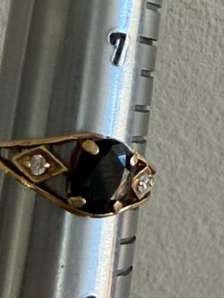 14k yellow gold Ring with Dark Stone and Side Accents