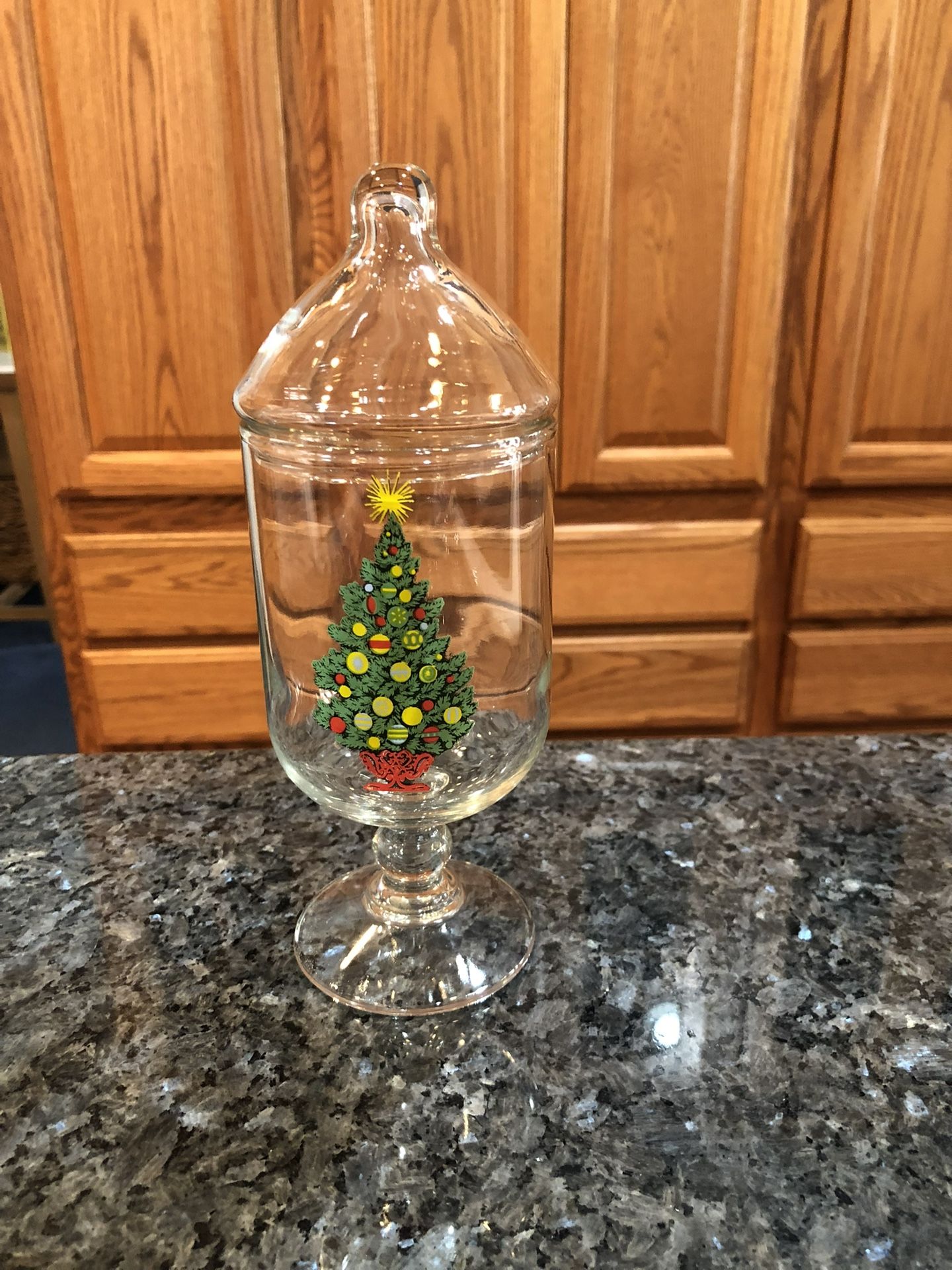 Vintage Carlton Glass Christmas Tree Pattern Footed Candy Dish With Lid. Size 8 inches tall. Preowned Excellent Condition. Has been on display in a