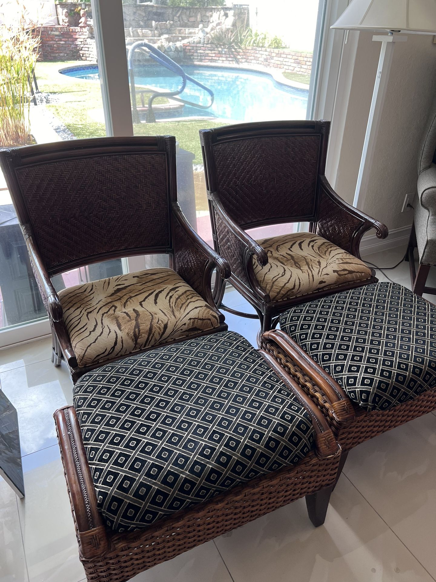 Pair Of Rattan Chairs with Ottomans 