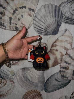 Light-up black cat hand sanitizer holder