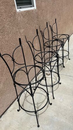 4 iron outdoor bar stool frames.