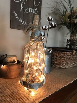 Lights in a bottle with seashells on
