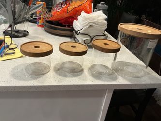 A set of 4 glass jars with bamboo lids