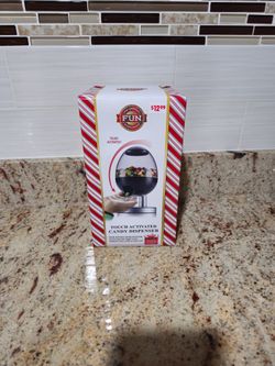Touch activated candy dispenser