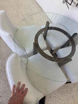 Glass table with 4 white chairs