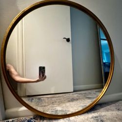 Stylish Metal Round Brushed Gold Mirror with Textured Frame.