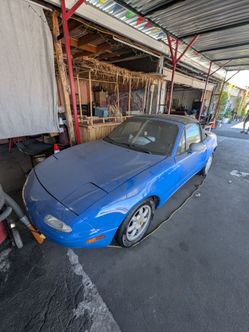 1990 royal blue Mazda Miata