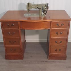 Sewing machine with antique desk