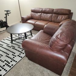 Used Italian Leather Couch With Coffee Table And Carpet 