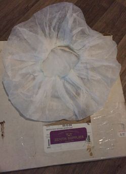 One box of white non-woven work caps