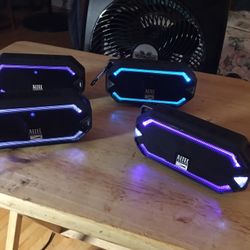 2 pairs of colored syncing speakers lot