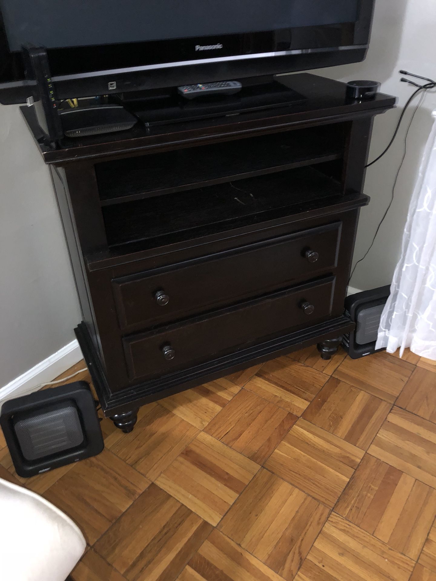 Solid wood black TV stand with 2 drawers. 38” high, 36” wise, 17” deep. Very good condition.