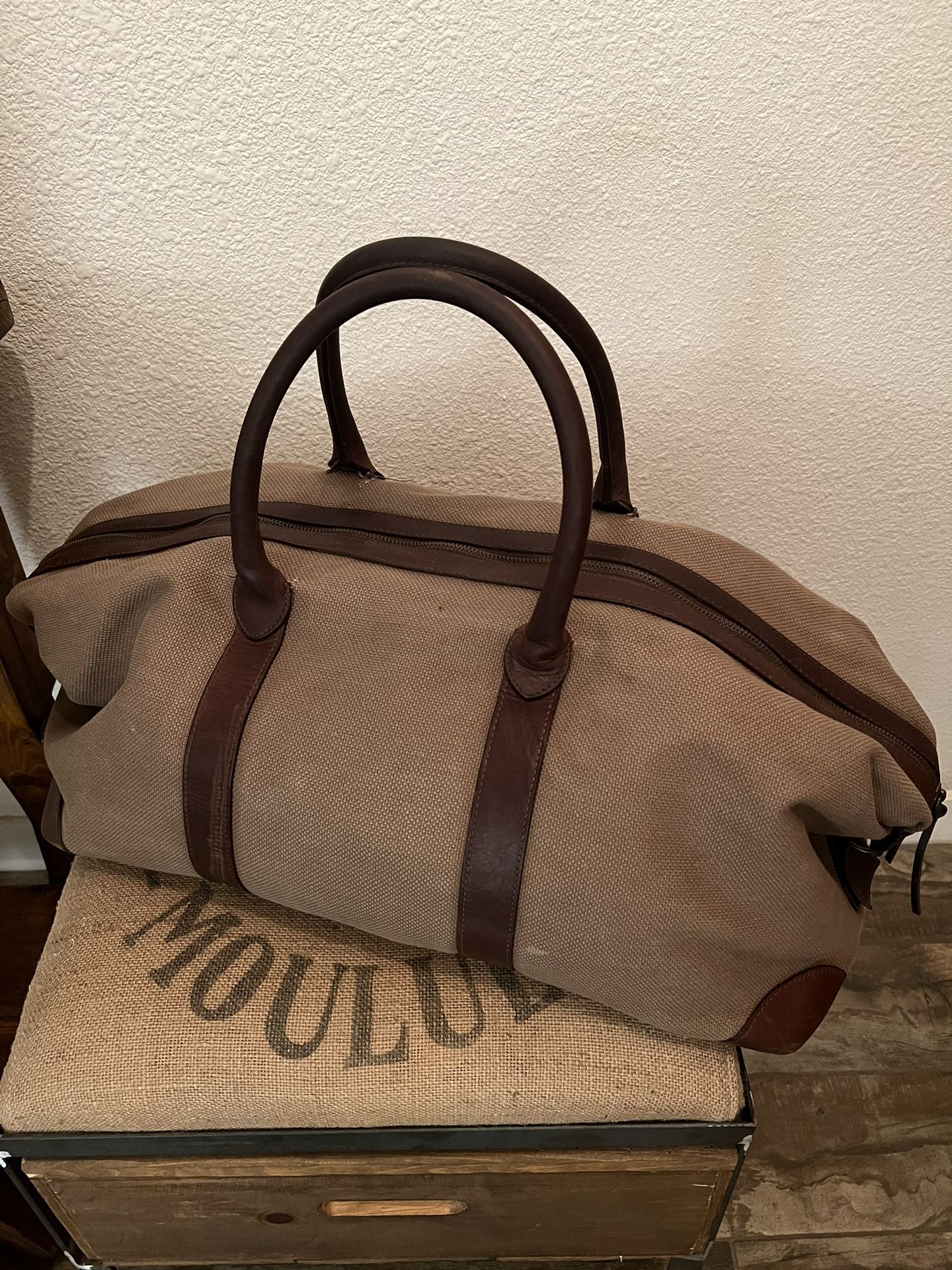 Gently Used Heavy Soft And Sturdy Canvas And Brown Leather Handles And Trim With 5 Rubber Feet On Bottom Of Bag