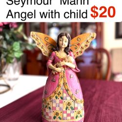 Vintage Seymour Mann Angel with child wood carved look . Great Christmas gift, like new