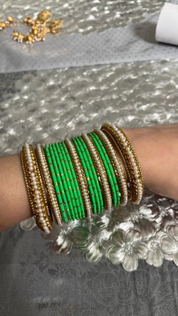 Matching set bangle, bracelets, and ear