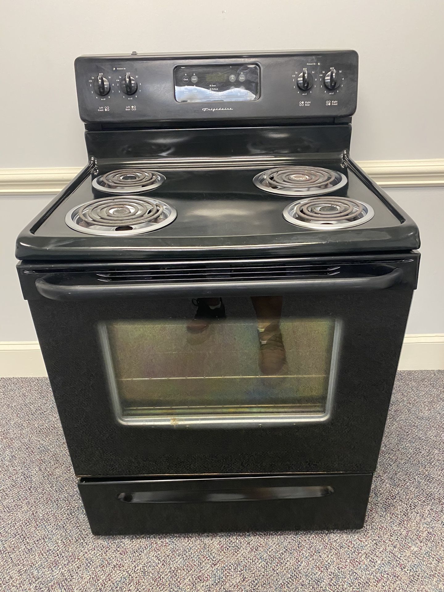 Black Frigidaire coil top stove with 4 MONTH WARRANTY