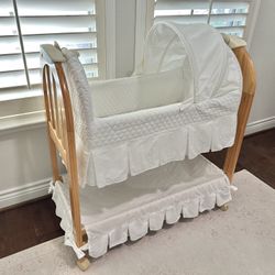 Eddie Bauer Wooden bassinet with wheels