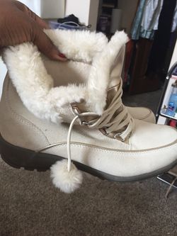 Nice cream color off white boots with fur balls and gold leather tongue new condition really nice