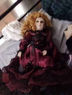 porcelain doll with hat and umbrella