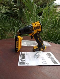 DeWalt 20 v new. Atomic.  Hammer drill.  1/2".  2 speed.  W/ Battery.   2.0 AH. . Lithium