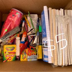 Box of school supplies, and paper