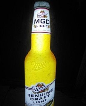 MGD Light Very Sign It's Two Feet Five Inches High And About 7 In Wide Very Nice Beer Sign Rare Lights Up Looks Real When Lit Up.