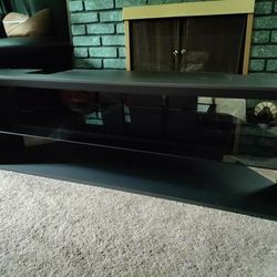 T.V Stand W/ Glass Shelf! Holds up to a 65" T.V! 