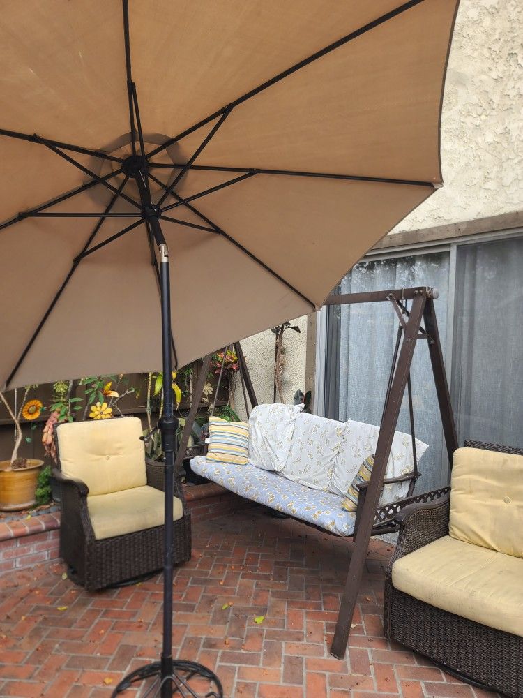 2 patio chairs and swing