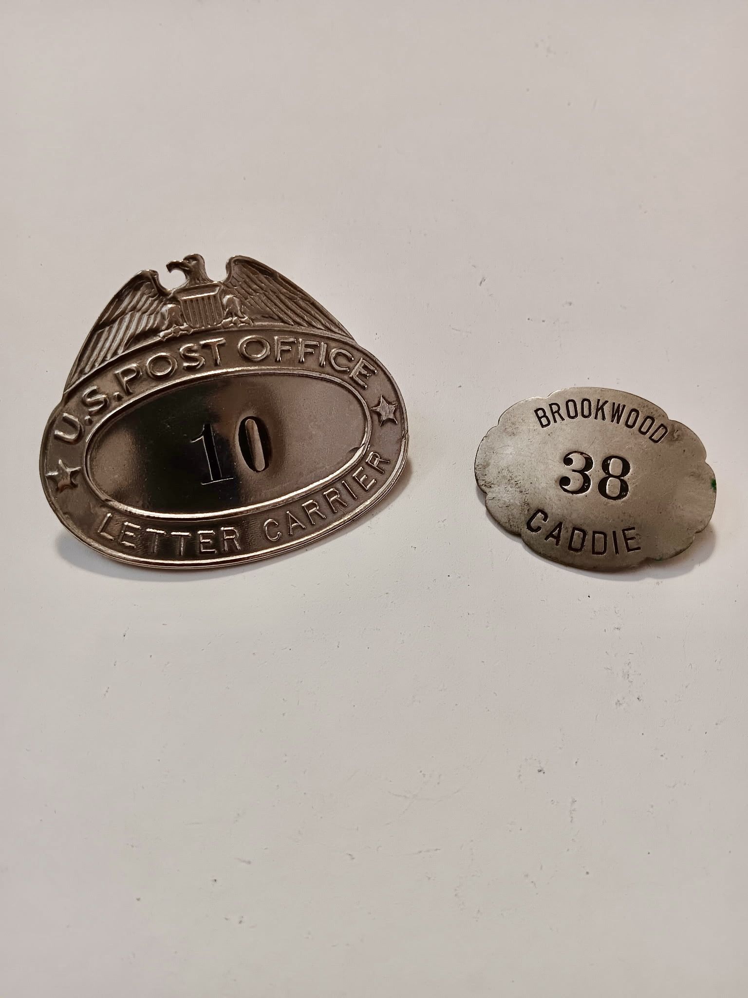 Vintage Advertising. Two old Advertising post office and taxi badges.