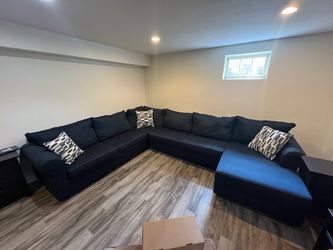 Bob's Discount Furniture Navy Blue Sectional Sleeper Sofa with Chaise