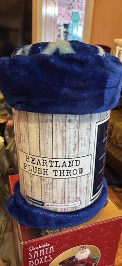 American Heritage throw blanket features a blue "Love, Hope, Peace" design