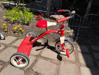 Red classic radio flyer tricycle for beginners