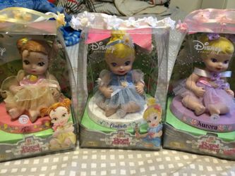 3 porcelain Disney Princess dolls