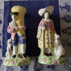 A pair of vintage 1993 ceramic vases manufactured by The Haldon Group, featuring an Irish lad and lass in a Majolica style