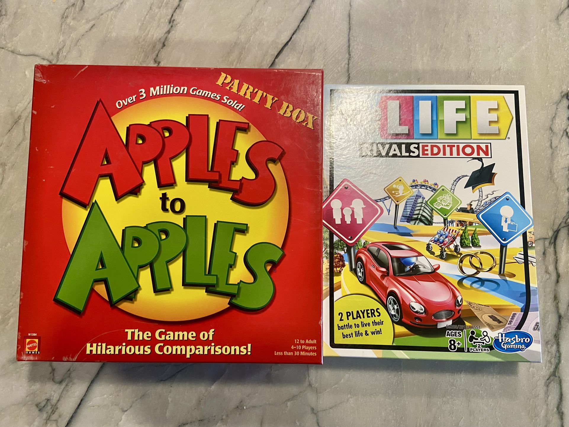Board games / card games: Apples to Apples party box and Life Rivals edition. Good used condition. 