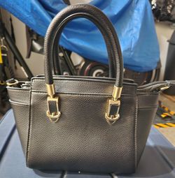 Small black handbag with gold-tone hardware 