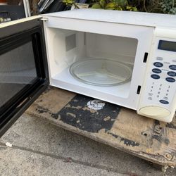 Small Microwave In Good Condition  18” Wide  13” Side  10” High 