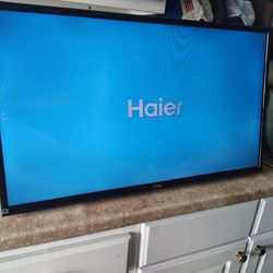 Haier 32" TV with remote and wall mounting bracket