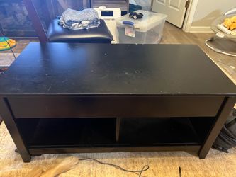 Coffee table with lift top