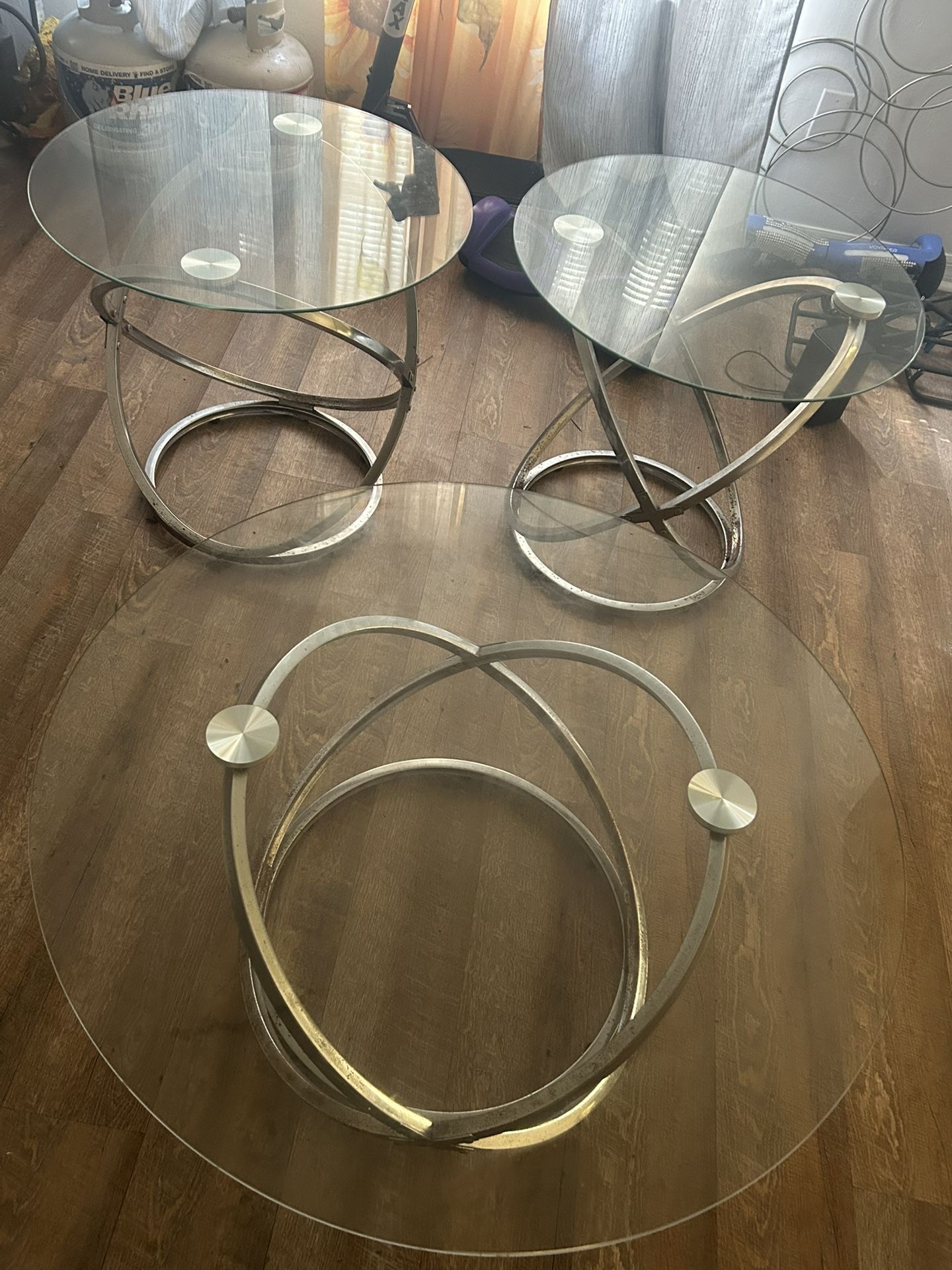 “3-Piece Glass Table Set — modern design with chrome base. Great condition! Perfect for living room or lounge area.