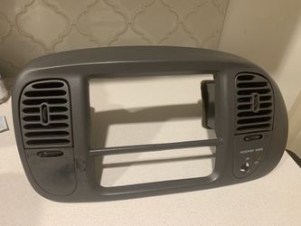 ) Ford F-150 Radio Bezel -Grey . Check If the one you are looking for has the plastic bar in the middle of the bezel.