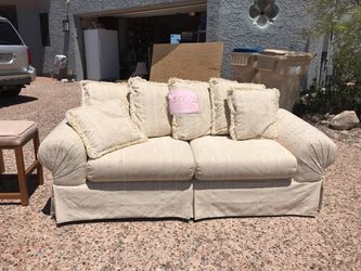 Cream couch with pillows