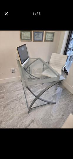 Glass desk and ergonomic office chair