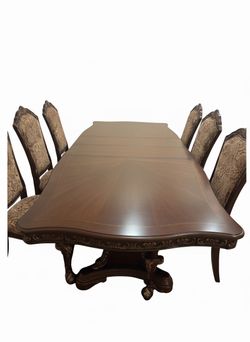 Solid wood table and 8 chairs. Barely used.
